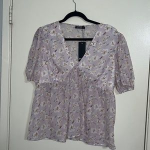 Floral print flowy top. Never worn.